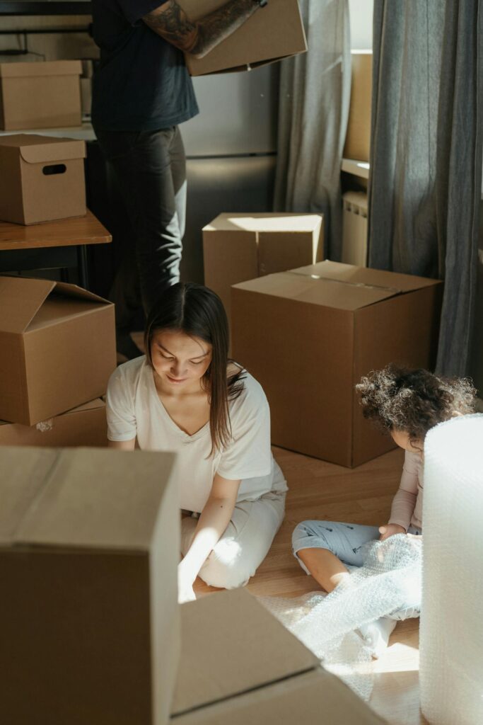 Family packing boxes for a move in the Harrison area